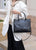 Noir Embossed Leather Handbag